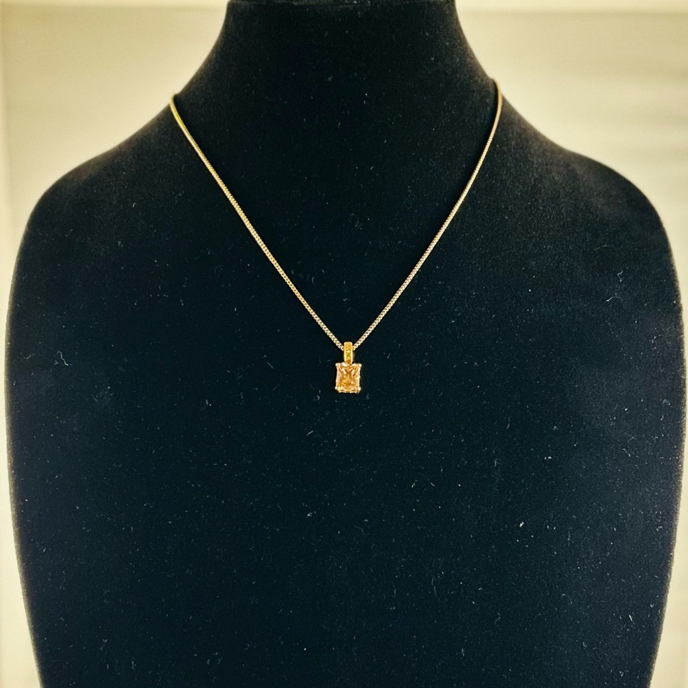 Gold colored, chain necklace with June birthstone.